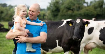 Alan Clarke with his daughter on their family farm.
