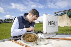 A Lakeland Dairies team member conducting forage testing.