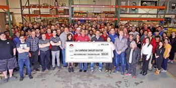 Big group of people holding check