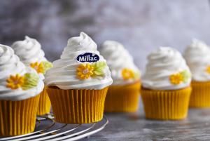 Close up cupcakes made with Millac cream amd Millac logo