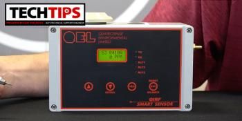 Black product on table with man behind