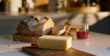 Lakeland Dairies butter on chopping board with soda bread and jam
