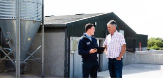 Lakeland Dairies team member Niall McLoughlinn with a Lakeland Dairies milk supplier.