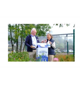 Eimear Hanley and Tommy O'Donaghue in front of carton of Champion Milk