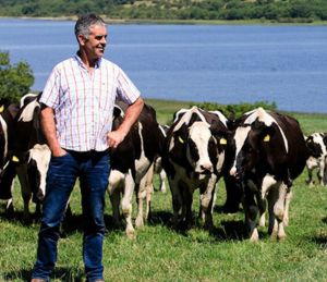 Farmer Thomas Loughrey in front of cows