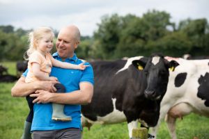 Milk supplier Alan Clarke and his daughter on their farm.