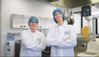Two employees working in the Lakeland Dairies labs.